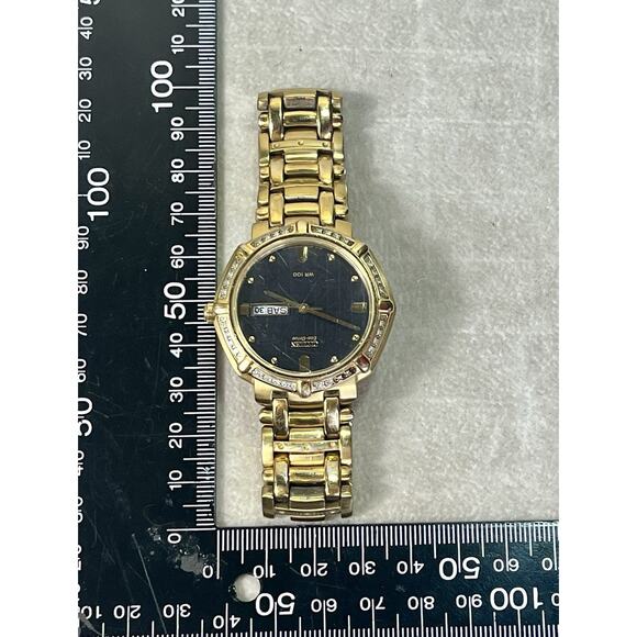 Citizen Eco-Drive Diamond Bezel Gold Tone Day Date Spanish WR100 Watch Works main image 15